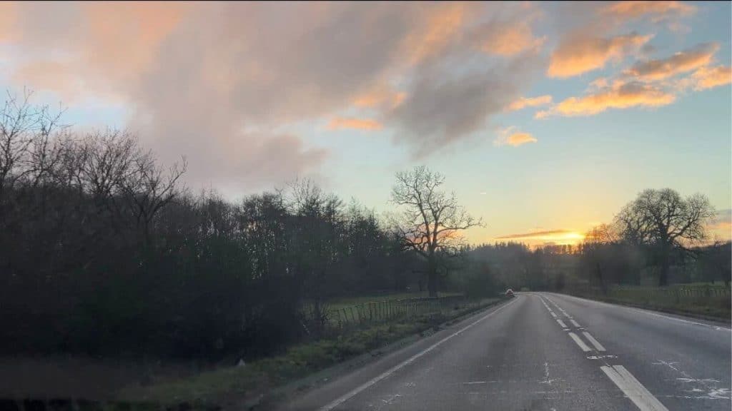 Road converging with sky