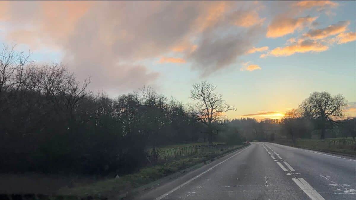 Road converging with sky
