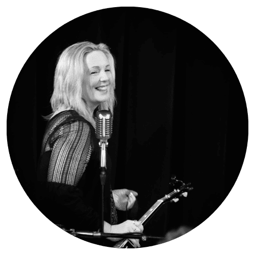 Black and white image of blonde woman holding a ukulele