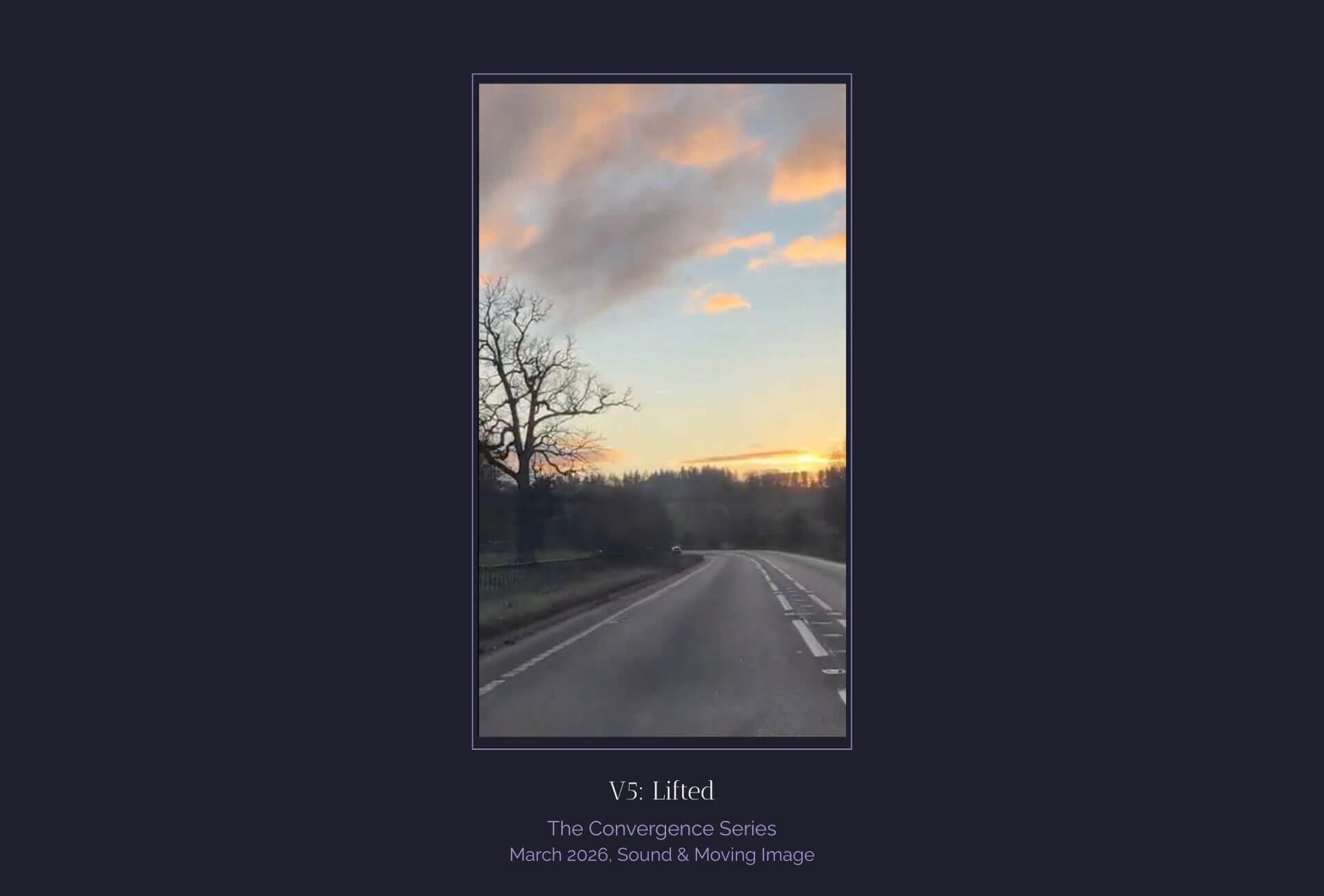 Sky with orange clouds and road bending to the left